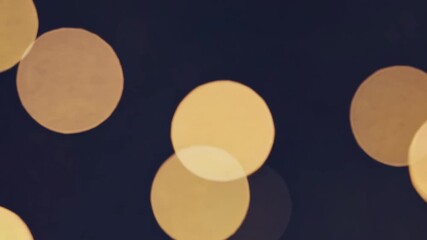 Aufkleber - Golden bokeh lights against a dark background, abstract festive texture. Celebration mood.