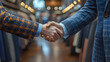 © Ida - Close-up of successful partnership handshake in clothing store symbolizes trust and agreement