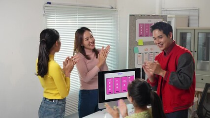 Wall Mural - enthusiastic designers celebrating successful app development