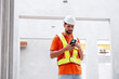 © krongthip - Male engineer wearing safety helmet working at construction site.