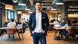 © Sorapong - Confident businessman smiling with hands in pockets in modern office