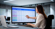 © Andrey Popov - Woman in office signs weekly payroll time sheet for overtime