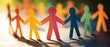 © Fernando - Colorful paper cut out people holding hands representing unity, diversity, and teamwork in a bright, positive, and inclusive community