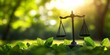 © El Media - A balanced scale atop green leaves, representing the concept of justice and environmental protection
