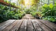 © Oleg - Rustic wooden tabletop surrounded by blurred greenery and fresh vegetables for product presentation