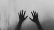 © Inspire Shots Hub - Silhouette of two hands reaching against a foggy surface. This image symbolizes a sense of longing, separation, or the emotional struggle of being trapped behind an invisible barrier.