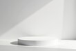 © Vibrant Visions Pixe - A Minimalist White Circular Platform in Soft Sunlight Against a Blank Wall, Perfect for Product Display or Abstract Composition