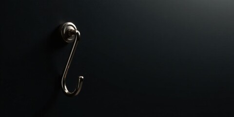 Aufkleber - A Single, Elegant, Metallic Hook Adorned on a Dark Surface, Providing a Minimalist and Modern Aesthetic for Design Applications