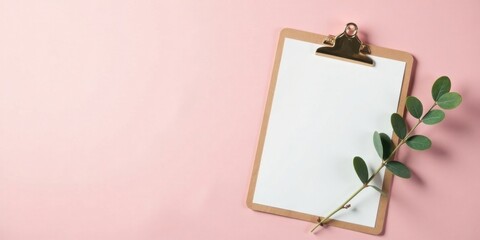 Aufkleber - Blank clipboard with sprig of greenery on a pink background, perfect for note-taking or showcasing your ideas.