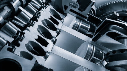 Poster - A close up of a car engine with the pistons and cylinders visible. Concept of complexity and precision, as the various components of the engine work together to create power and motion