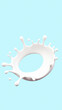 © Rysak - circular milk splash on light blue background