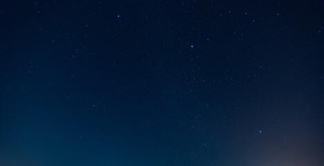 Wall Mural - from below picturesque view of starry blue sky with clouds. panorama blue night sky milky way and st