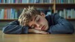© Adi - Tired sleepy napping exhausted fatigued overworked overload pupil teen boy teenager sleep, boring class lesson sleeping at table school