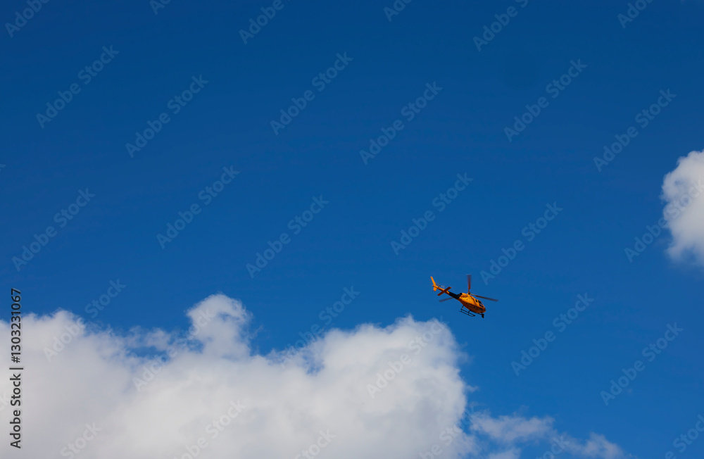 Television helicopter. A helicopter with a camera records images of an ...