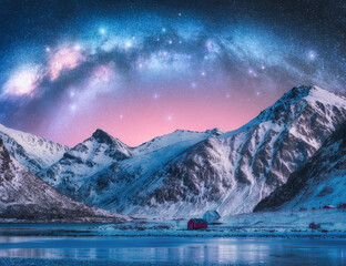 Wall Mural - milky way arch above fjord and snowy mountains on starry winter night. lofoten islands, norway. pano