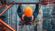 © All in Stock - A rope access maintenance worker, wearing a safety harness and hard hat, descends on a rope to inspect a lifting chain block on a beam clamp trolley before use at a construction site.