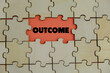 © Ardini - Close up of the last jigsaw puzzle piece with word outcome