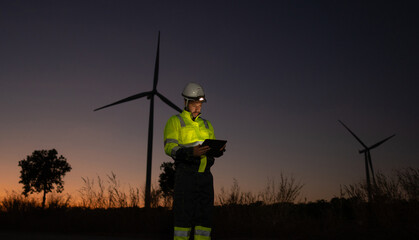 Aufkleber - Engineer man working with tablet at windmill farm Generating electricity clean energy. Wind turbine farm generator by alternative green energy.
