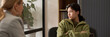 © Mediaphotos - Header image of angry teenage girl stonewalling therapist during counseling meeting