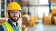 © Newleks - Portrait of a supervisor wearing protective workwear posing in a warehouse or factory, representing workplace safety and industrial work environments