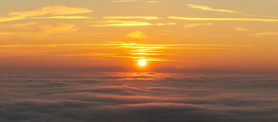 Wall Mural - sunset above the clouds-panorama