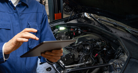 Fototapete - Serviceman with tablet checks car software in car service