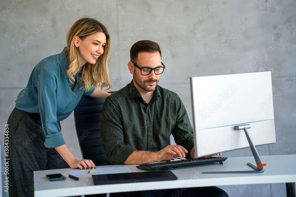 Business professionals collaborating on a project in a modern office ...