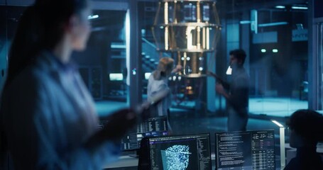 Team of Engineers and Scientists Develop Quantum Computing Hardware, Using Tablet and Desktop Computers for Research, Testing and Collaborating with Colleagues in an Advanced Office