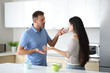 © Antonioguillem - Interracial roommates arguing in the kitchen