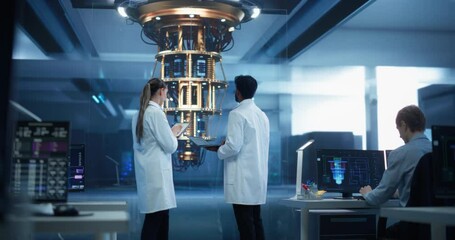 Computer Science Students Having a Conversation About Developing Technology for a Powerful Quantum Processor. Diverse Male and Female Developers Working on Tablet Computer in a Research Facility