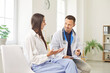 © Studio Romantic - Doctor or nurse conducting a medical consultation with a female patient in a hospital office. Healthcare professional offers medical advice and support, ensuring the patient comfort during the visit.