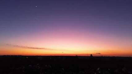 Wall Mural - beautiful sunset over Leipzig with half moon in colorful sky