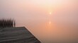 © fabienne - Panorama d'un magnifique lever de soleil sur un lac avec ponton
