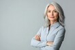© JAYDESIGNZ - Portrait Of Mature Businesswoman Posing With Folded Arms Over Light Studio Background, Panorama With Free Space
