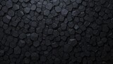 A textured background of dark geometric polygonal shapes is seen