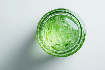 Wall Mural - a vibrant green jar filled with textured elements. the light reflects off the surface. a view from a