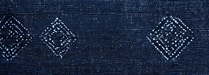 Wall Mural - a traditional japanese sashiko weave pattern with deep indigo tones and white-threaded details