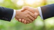 © sun - Two men shaking hands representing business partnership between public and private sectors