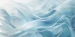 © Katsiaryna - Abstract sky blue background. Texture of weightless fabric, delicate folds of material