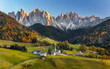 © Ewout Pahud - Autumn in Alps. Beautiful St. Magdalena village with magical Dolomites mountains in a gorgeous Val di Funes valley, South Tyrol, Italian Alps at autumn sunset.