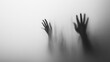 © Mamed - A blurry black-and-white photo of two hands behind foggy glass, creating an eerie atmosphere.