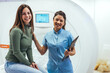 © Dragana Gordic - Smiling Nurse With Patient at Medical MRI Scan Facility