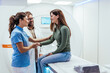 © Dragana Gordic - Friendly Medical Professionals Assisting a Patient During a Diagnostic Imaging Session