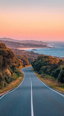 Wall Mural - Scenic Coastal Road Journey at Sunset with Lush Greenery and Distant Ocean Views offering a Serene and Inviting Travel Experience