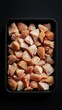 © arri - Cubed chicken breast pieces in a black tray