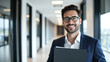 © Giuseppe Cammino - Businessman wearing glasses and holding a folder in a bright, modern office hallway. Expresses confidence, success, and professionalism in a professional work environment