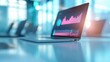 © Namwan - Laptop displaying business analytics, modern workspace with vibrant screen and reflections, ideal for presentations and reports.