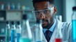 © CaspernikMed - Focused Black Young Adult Scientist Working in Laboratory