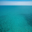 © Rebekah - Small ripples on sea surface, blue-green water near tropical island of Thailand. Static view of empty open space, light haze from midday heat seen at horizon line