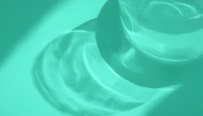 Poster - soft abstract reflection of water in a glass with turquoise light, modern minimal background for design, texture, and art

